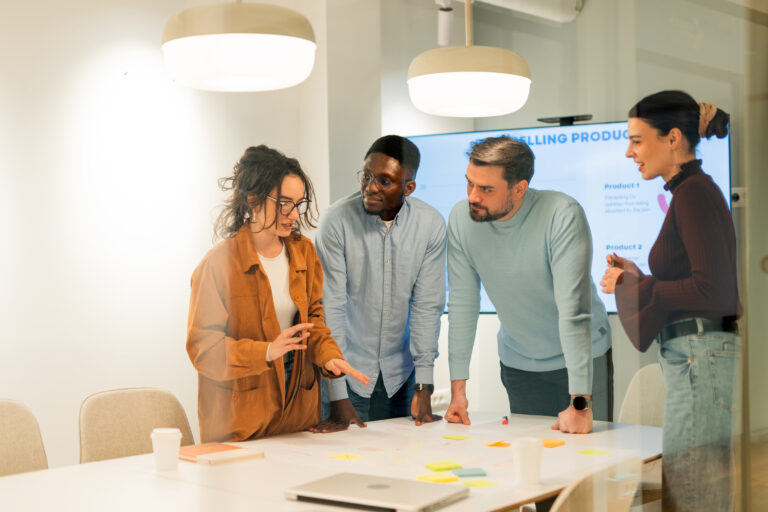 Marketing team analyzing data and developing new selling product during a meeting